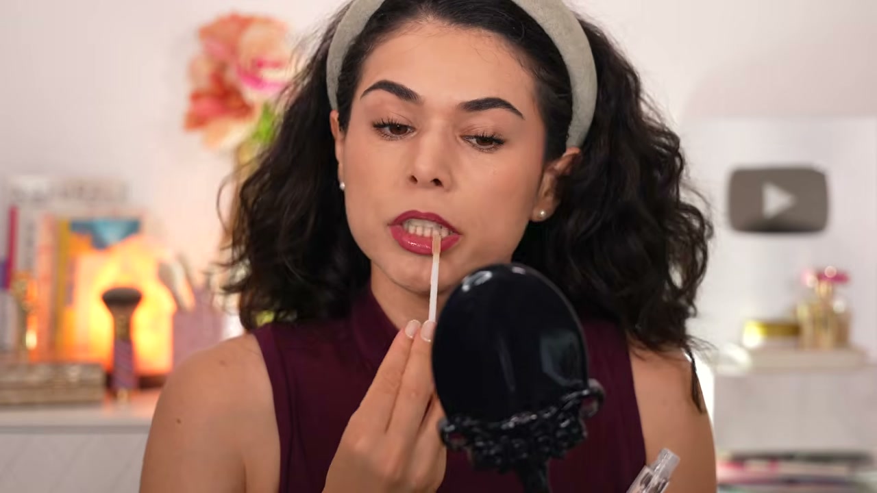 @slashedbeauty reviewing ColourPop Ultra Glossy Lip at 19:21 in a YouTube Shorts video