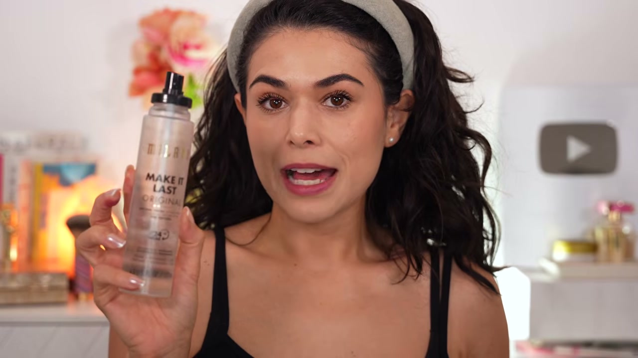 @slashedbeauty reviewing Milani Make It Last Setting Spray at 12:26 in a YouTube Shorts video