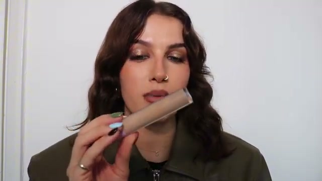 @sophiefloyd reviewing Tower 28 Beauty Serum Concealer at 15:30 in a YouTube Shorts video