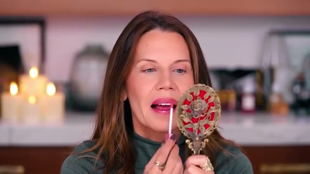 @tati reviewing Dollar Tree Lip Plumping Gloss at 12:15 in a YouTube Shorts video