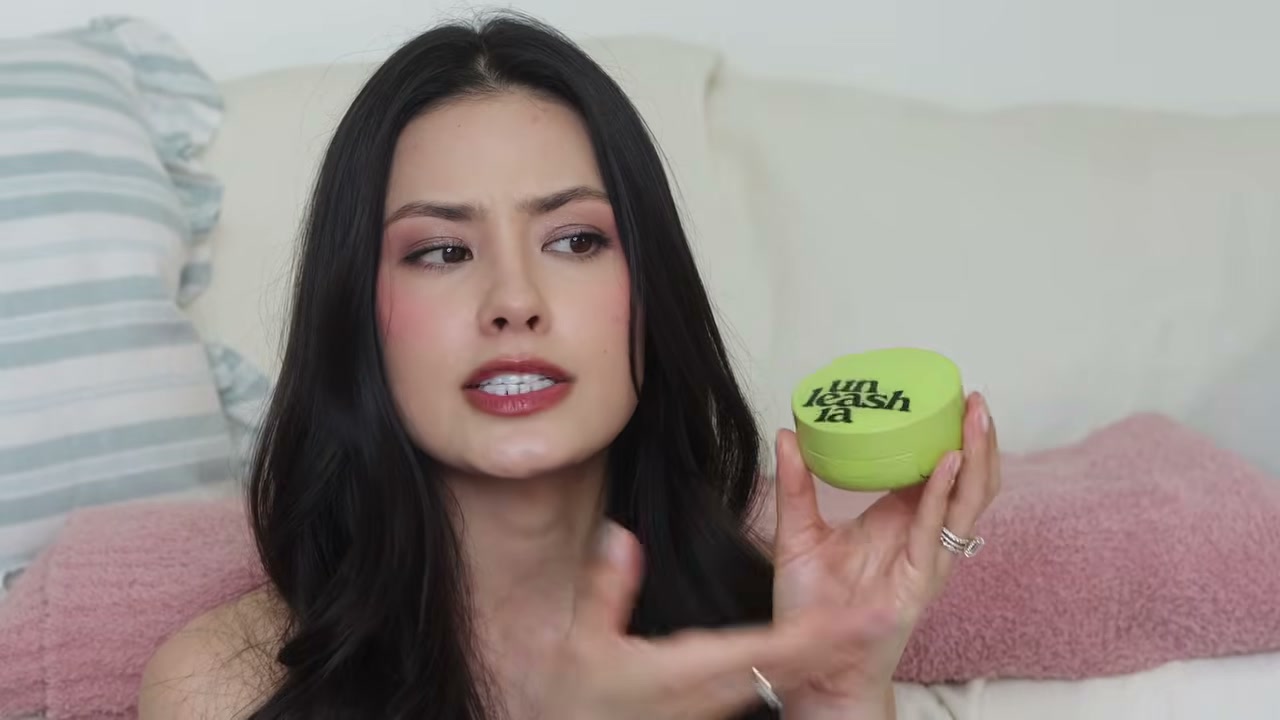 @thebeautybreakdown reviewing Unleashia Satin Wear Healthy-Green Cushion at 04:37 in a YouTube Shorts video