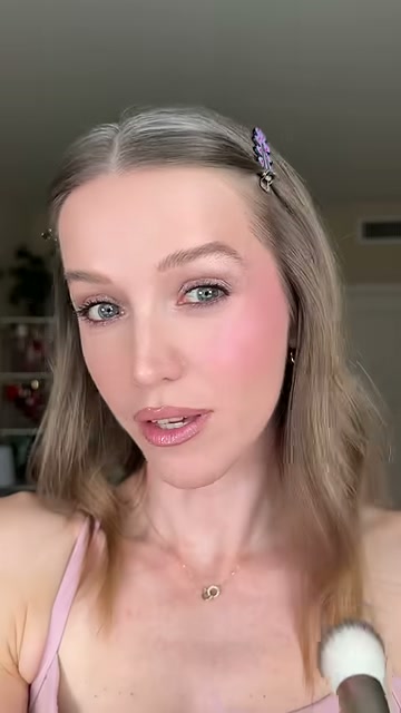 @theelenakoira reviewing Benefit Cosmetics Dew Stick at 00:35 in a YouTube Shorts video