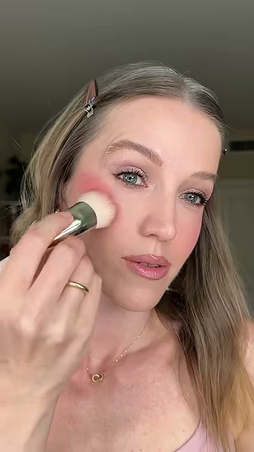 @theelenakoira reviewing Benefit Cosmetics Play Days Liquid Blush at 00:40 in a YouTube Shorts video