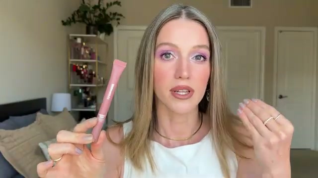 @theelenakoira reviewing CoverGirl Squishy Glaze Lip Balm at 29:02 in a YouTube Shorts video