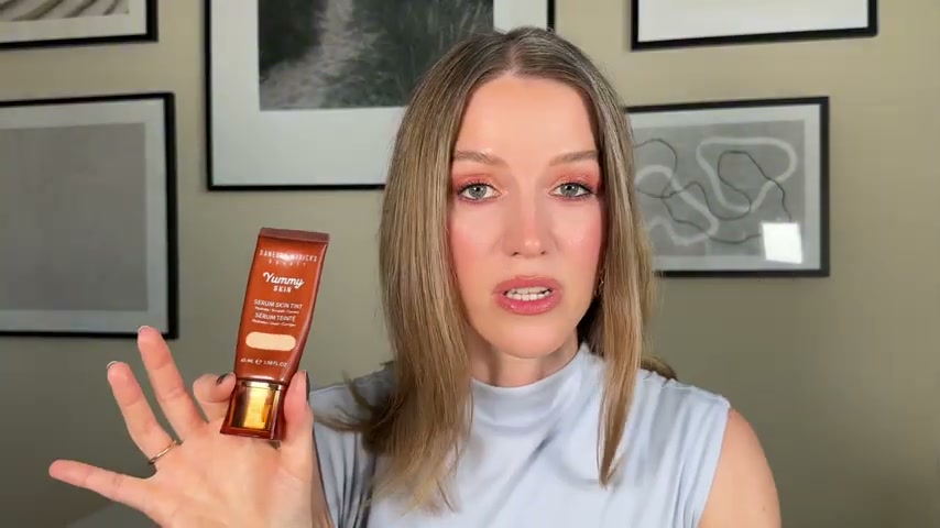 @theelenakoira reviewing Danessa Myricks Beauty Yummy Skin Serum Skin Tint at 05:53 in a YouTube Shorts video