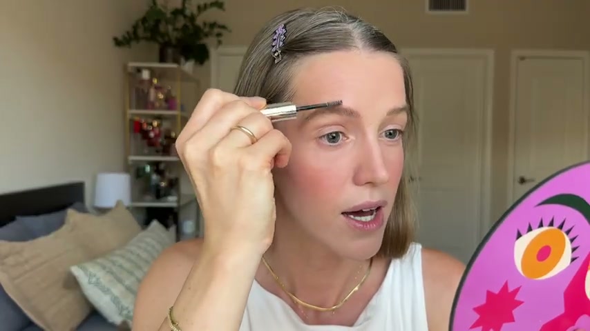 @theelenakoira reviewing Rare Beauty Eyebrow Gel at 15:32 in a YouTube Shorts video
