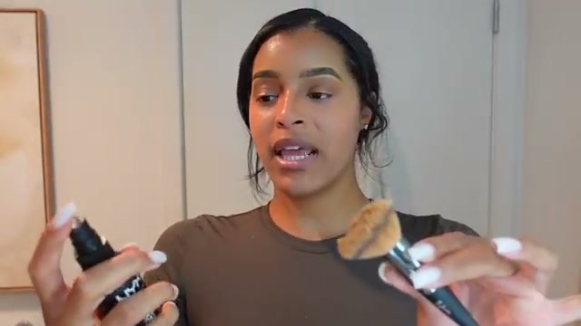 @thekylesisters reviewing Charlotte Tilbury Airbrush Flawless Setting Spray at 21:11 in a YouTube Shorts video