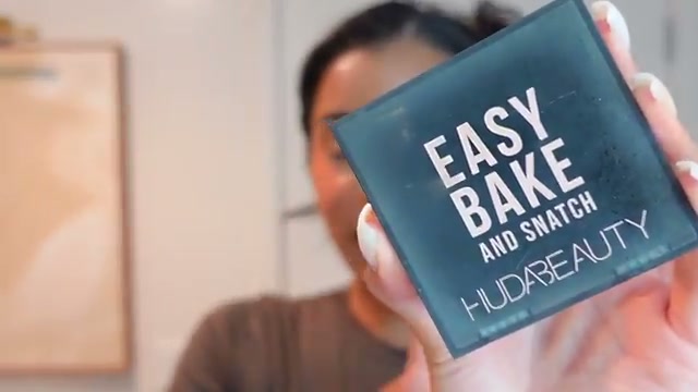 @thekylesisters reviewing Huda Beauty Easy Bake and Snatch Pressed Powder at 28:35 in a YouTube Shorts video