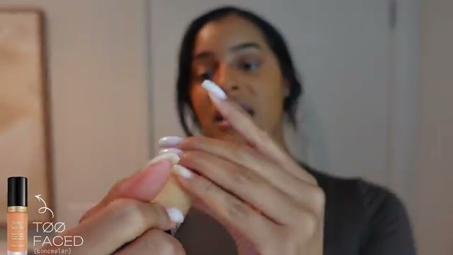 @thekylesisters reviewing Too Faced Sculpting Concealer at 23:29 in a YouTube Shorts video