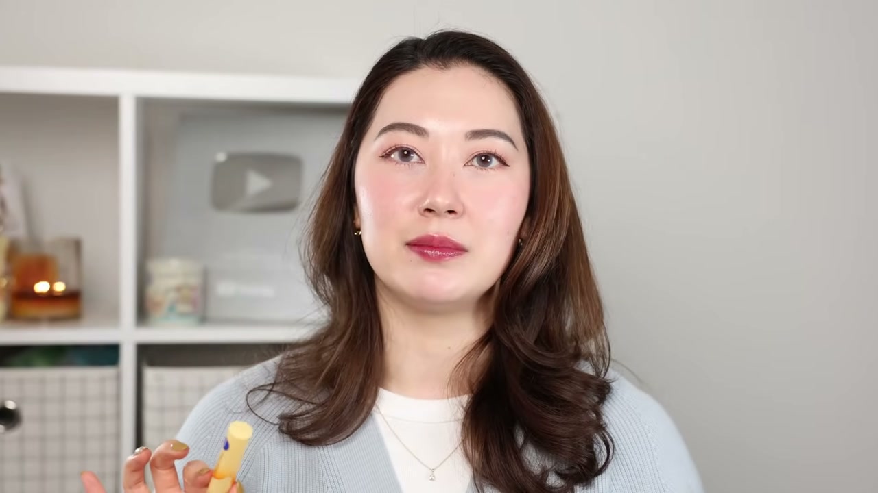 @tinatanakaharris reviewing Nivea Deep Moisture Lip Melty Type at 23:00 in a YouTube Shorts video