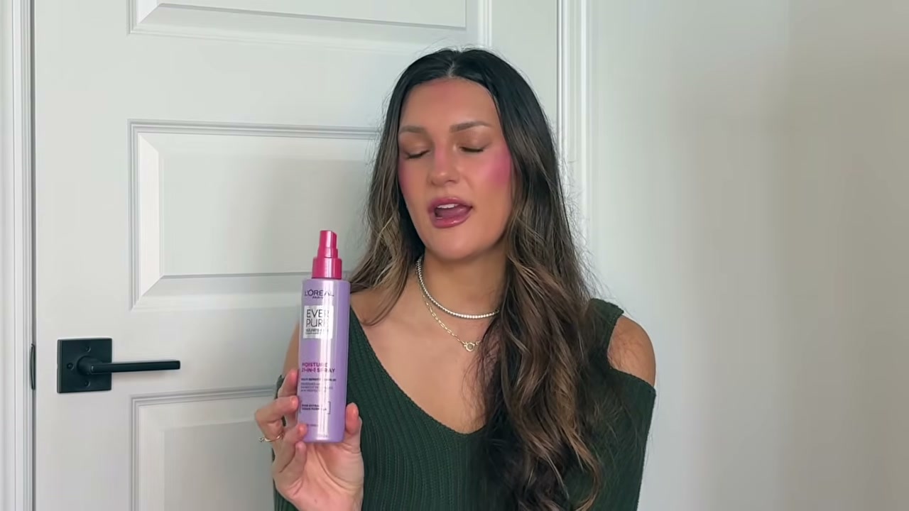@tristin_jade reviewing L'Oreal Paris 21-in-1 Leave-in Conditioner Spray at 07:04 in a YouTube Shorts video