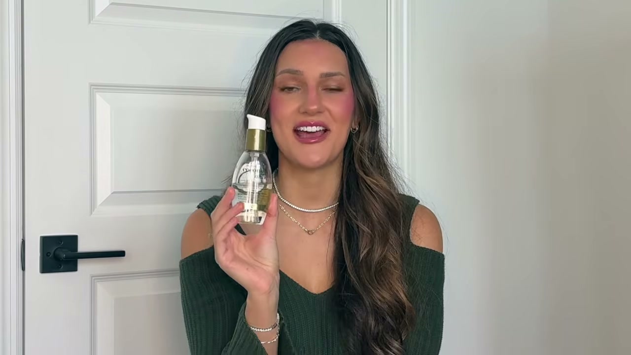 @tristin_jade reviewing OGX Coconut Milk Anti-Breakage Serum at 04:15 in a YouTube Shorts video