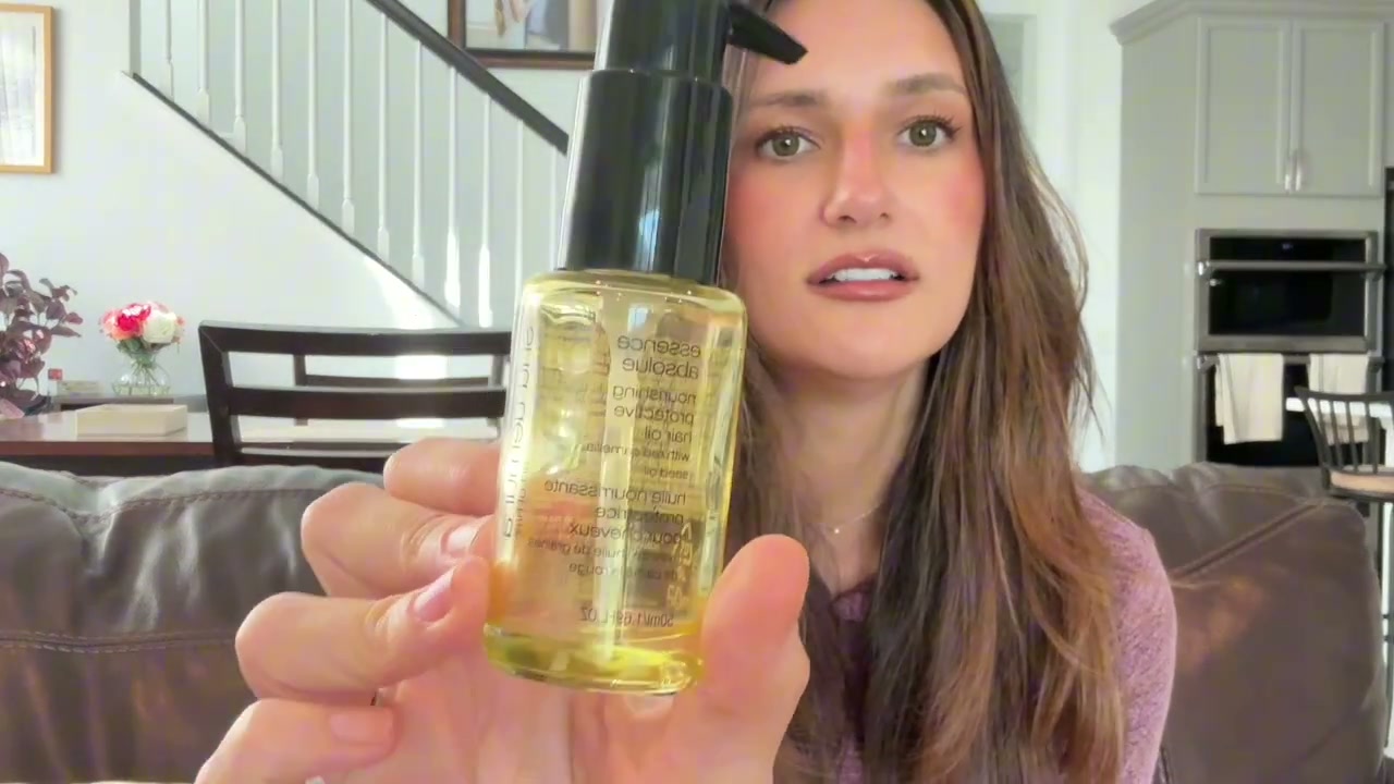 @tristin_jade reviewing shu uemura Essence Absolue Nourishing Protective Hair Oil at 05:24 in a YouTube Shorts video