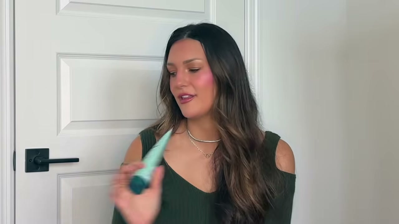 @tristin_jade reviewing shu uemura Essence Absolue Nourishing Hair Oil at 08:34 in a YouTube Shorts video