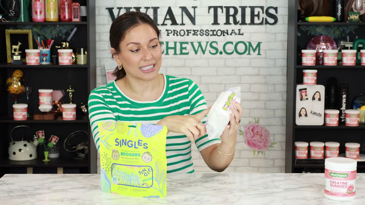 @vivian_tries reviewing Boogie Wipes Saline Nose Wipes at 15:07 in a YouTube Shorts video